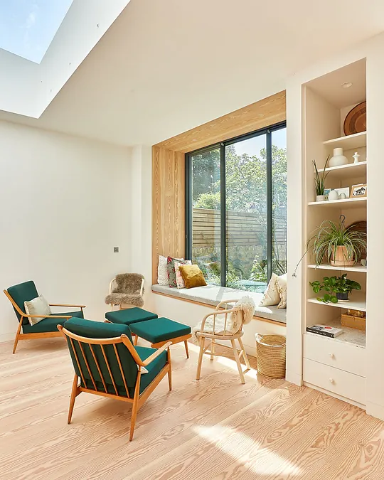 Wide plank Douglas fir wood flooring with a white oil finish in a living room
