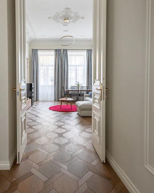 Mansion weave parquet flooring through double doors in an Edinburgh apartment